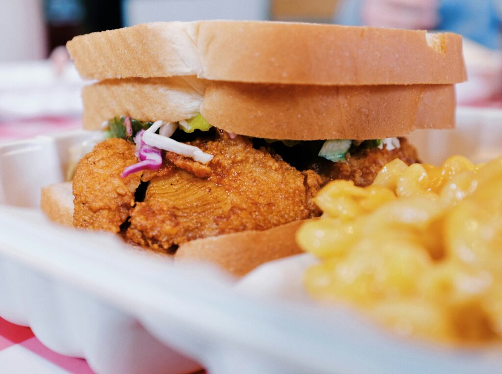 Hot Chicken sandwich and macaroni and cheese 