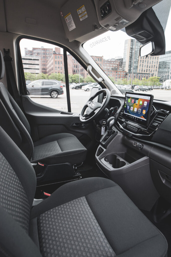 Interior front seats of a Ford Transit business van rental from Greenvans