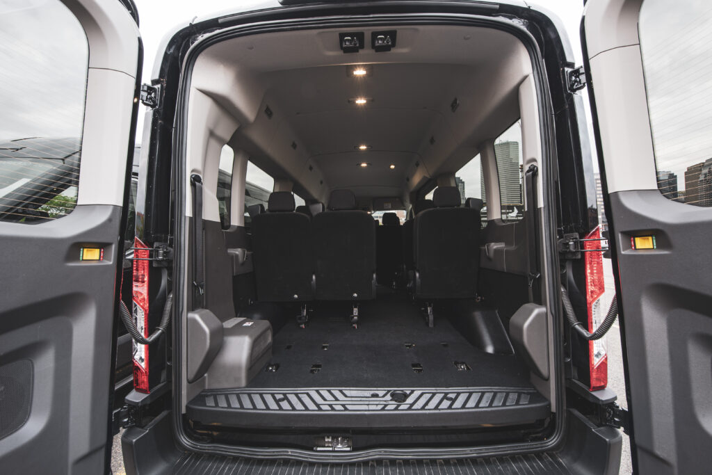 The ample cargo space in a Greenvans' Ford Transit passenger van rental.