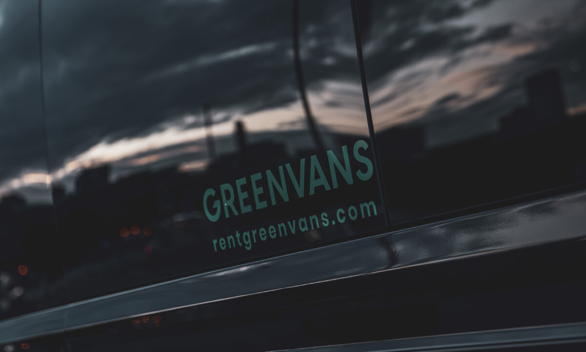 Logo on a Greenvans passenger van rental