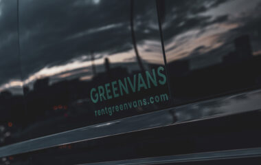 Logo on a Greenvans passenger van rental
